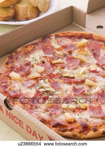 Picture - Hawaiian Pizza In A Take Away Box With Garlic Bread. Fotosearch