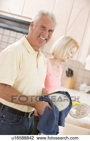 Husband And Wife Cleaning Dishes View Large Photo Image Stock Image - Husband And Wife Cleaning Dishes. Fotosearch