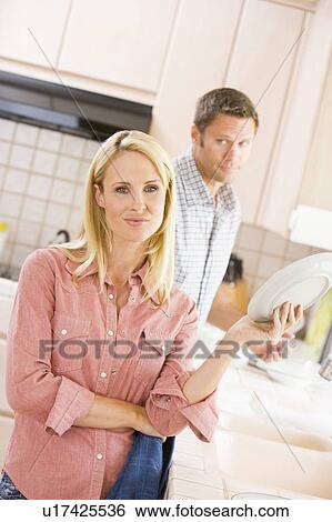 Husband And Wife Doing Dishes View Large Photo Image Stock Photograph - Husband And Wife Doing Dishes. Fotosearch