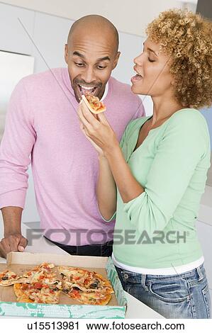 Husband And Wife Eating Pizza View Large Photo Image Stock Image - Husband And Wife Eating Pizza. Fotosearch