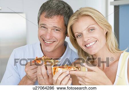 Husband And Wife Eating Pizza View Large Photo Image Stock Photograph - Husband And Wife Eating Pizza. Fotosearch
