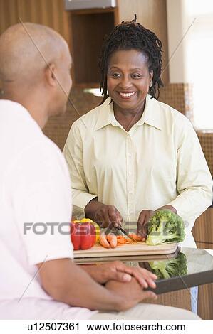 Husband And Wife Preparing A meal, mealtime Together View Large Photo Image Stock Image - Husband And Wife Preparing A meal, mealtime Together. Fotosearch