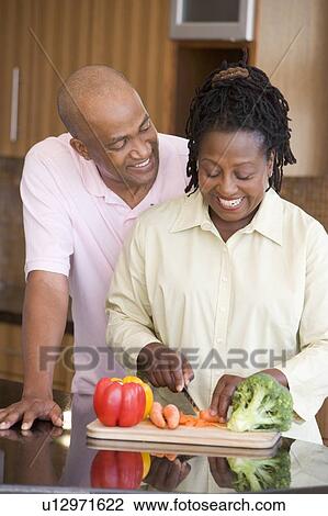 Husband And Wife Preparing A meal, mealtime Together View Large Photo Image Stock Image - Husband And Wife Preparing A meal, mealtime Together. Fotosearch