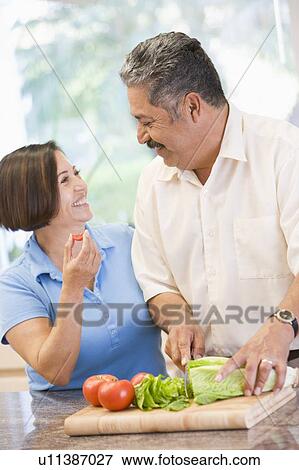 Husband And Wife Preparing meal, mealtime Together View Large Photo Image Stock Photo - Husband And Wife Preparing meal, mealtime Together. Fotosearch
