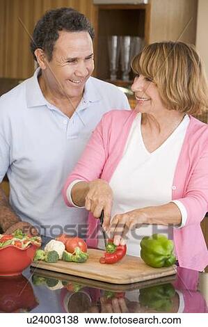 Husband And Wife Preparing meal, mealtime Together View Large Photo Image Stock Photo - Husband And Wife Preparing meal, mealtime Together. Fotosearch