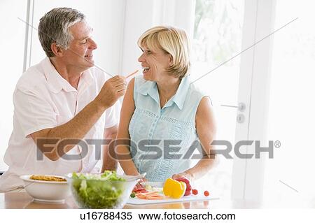 Husband And Wife Preparing meal, mealtime Together View Large Photo Image Stock Photography - Husband And Wife Preparing meal, mealtime Together. Fotosearch