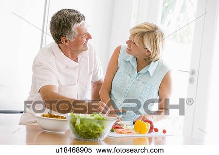 Husband And Wife Preparing meal, mealtime Together View Large Photo Image Stock Photography - Husband And Wife Preparing meal, mealtime Together. Fotosearch