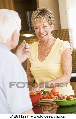 Husband And Wife Preparing Vegetables View Large Photo Image Stock Photo - Husband And Wife Preparing Vegetables. Fotosearch