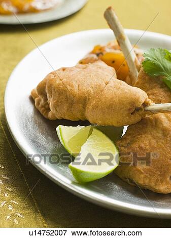 Kashmiri Lamb Cutlets with Lime Wedges and Mango Chutney View Large Photo Image Stock Photo - Kashmiri Lamb Cutlets with Lime Wedges and Mango Chutney. Fotosearch