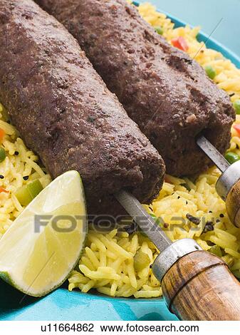 Stock Image - Lamb Mint and Garlic Sheesh Kebab with Pilau Rice. Fotosearch