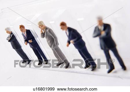 Stock Photo - Line Of Businessmen Figurines. Fotosearch
