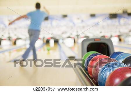 Stock Photo - Man bowling. Fotosearch