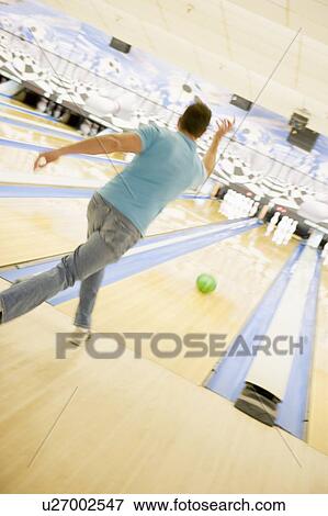 Stock Photo - Man bowling. Fotosearch