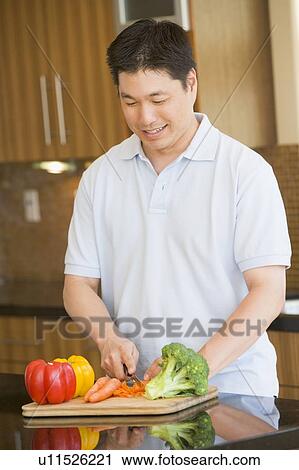 Man Chopping Vegetables View Large Photo Image Stock Image - Man Chopping Vegetables. Fotosearch