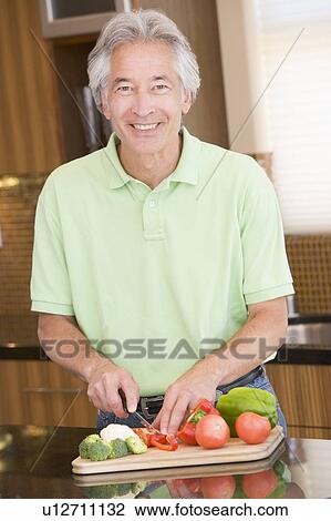 Man Chopping Vegetables View Large Photo Image Stock Image - Man Chopping Vegetables. Fotosearch