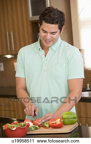 Man Chopping Vegetables View Large Photo Image Stock Image - Man Chopping Vegetables. Fotosearch