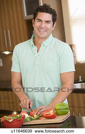 Stock Photo - Man Chopping Vegetables. Fotosearch