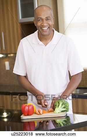 Man Chopping Vegetables View Large Photo Image Stock Photo - Man Chopping Vegetables. Fotosearch