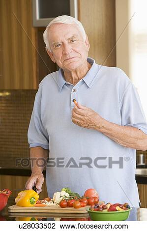 Man Cutting Up Vegetables View Large Photo Image Stock Image - Man Cutting Up Vegetables . Fotosearch