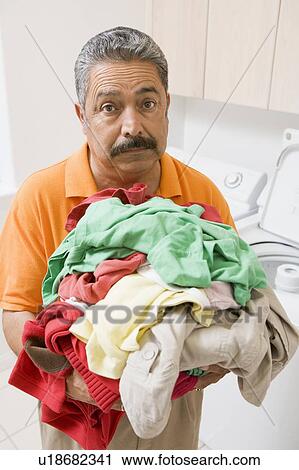 Stock Image - Man Doing Laundry. Fotosearch