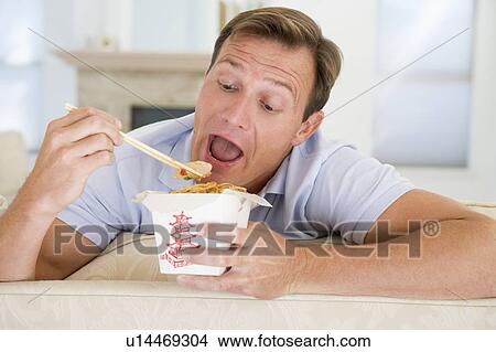 Man Eating Takeaways With Chopsticks View Large Photo Image Picture - Man Eating Takeaways With Chopsticks . Fotosearch