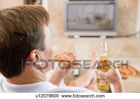 Man Enjoying Beer And Pizza In Front Of TV View Large Photo Image Stock Image - Man Enjoying Beer And Pizza In Front Of TV. Fotosearch