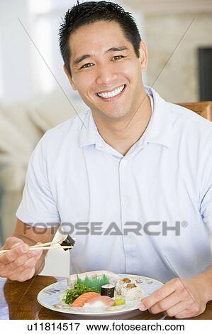 Man Enjoying Chinese Food With Chopsticks View Large Photo Image Stock Photo - Man Enjoying Chinese Food With Chopsticks. Fotosearch