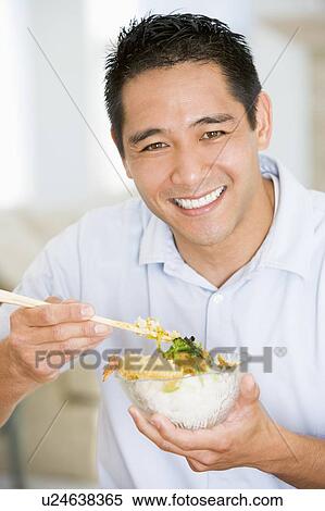 Man Enjoying Chinese Food With Chopsticks View Large Photo Image Stock Photography - Man Enjoying Chinese Food With Chopsticks. Fotosearch