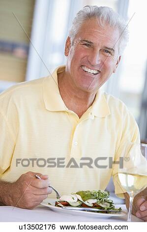 Man Enjoying Salad View Large Photo Image Stock Photograph - Man Enjoying Salad. Fotosearch