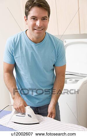 Man Ironing Shirt View Large Photo Image Stock Photo - Man Ironing Shirt. Fotosearch