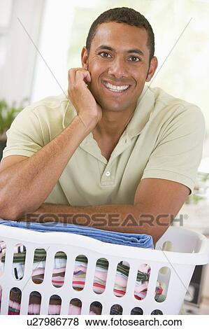 Man Leaning On Laundry View Large Photo Image Stock Photo - Man Leaning On Laundry . Fotosearch