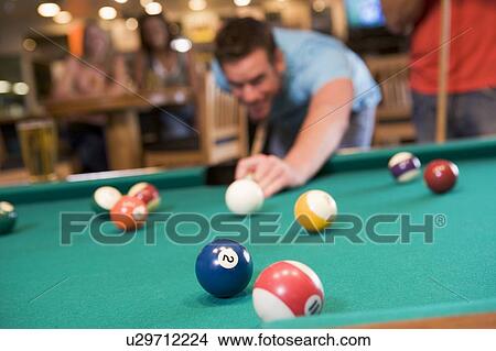 Man playing pool View Large Photo Image Picture - Man playing pool. Fotosearch