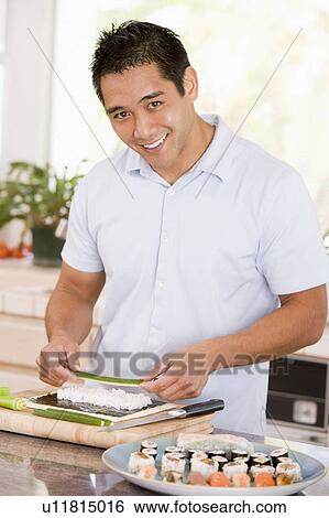 Stock Photograph - Man Preparing Sushi. Fotosearch