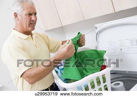 Man Reading Washing Instructions View Large Photo Image Stock Photo - Man Reading Washing Instructions. Fotosearch