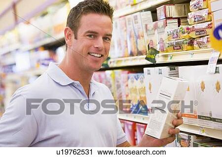 Man shopping at grocery store View Large Photo Image Stock Image - Man shopping at grocery store. Fotosearch