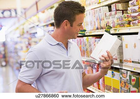 Man shopping at grocery store View Large Photo Image Stock Image - Man shopping at grocery store. Fotosearch