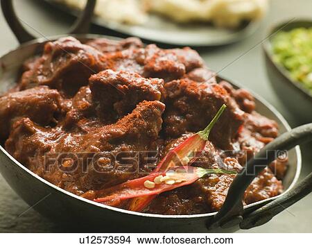 Meat Phall in Karahi with Naan and Green Chilli Curry View Large Photo Image Picture - Meat Phall in Karahi with Naan and Green Chilli Curry. Fotosearch
