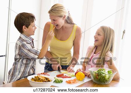 Mother And Children Prepare A meal, mealtime Together View Large Photo Image Picture - Mother And Children Prepare A meal, mealtime Together . Fotosearch