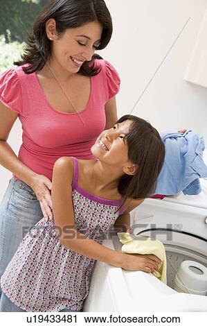 Mother And Daughter Doing Laundry View Large Photo Image Stock Image - Mother And Daughter Doing Laundry. Fotosearch