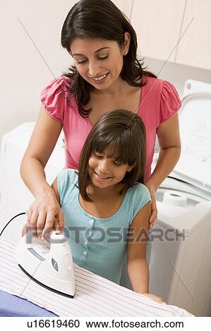 Mother And Daughter Ironing View Large Photo Image Stock Image - Mother And Daughter Ironing . Fotosearch