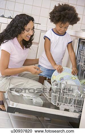 Mother And Daughter Loading Dishwasher View Large Photo Image Stock Image - Mother And Daughter Loading Dishwasher. Fotosearch