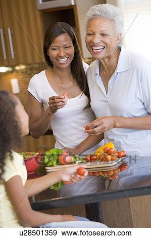 Mother And Daughter Preparing meal, mealtime Together View Large Photo Image Stock Photo - Mother And Daughter Preparing meal, mealtime Together. Fotosearch