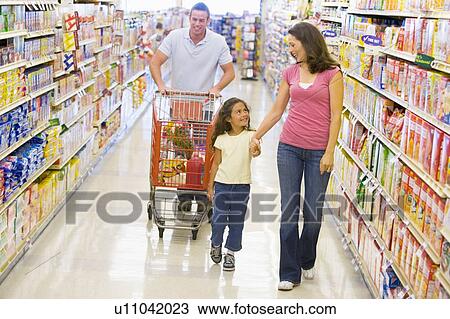 Mother and father with young daughter shopping for a new car View Large Photo Image Stock Image - Mother and father with young daughter shopping for a new car. Fotosearch