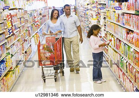 Mother and father with young daughter shopping at a grocery store. View Large Photo Image Stock Photograph - Mother and father with young daughter shopping at a grocery store.. Fotosearch