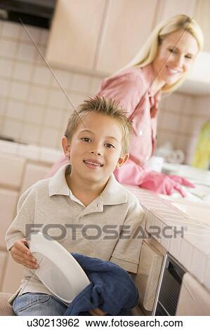 Mother And Son Cleaning Dishes View Large Photo Image Stock Image - Mother And Son Cleaning Dishes. Fotosearch