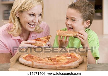 Mother And Son Eating Pizza Together View Large Photo Image Stock Photograph - Mother And Son Eating Pizza Together. Fotosearch