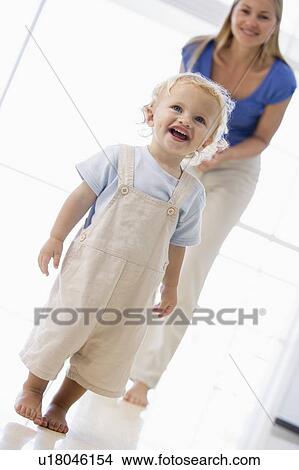 Picture - Mother and son indoors smiling. Fotosearch