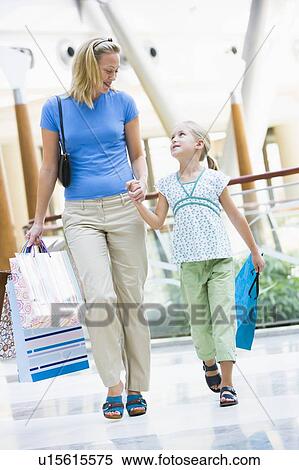 Mother and young daughter at a shopping mall View Large Photo Image Stock Photography - Mother and young daughter at a shopping mall. Fotosearch