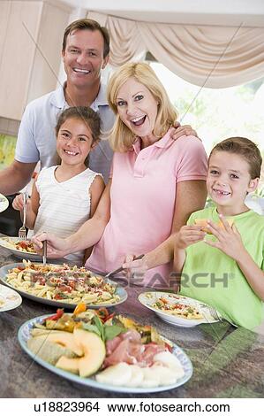 Mother Serving Up Dinner For Family View Large Photo Image Picture - Mother Serving Up Dinner For Family. Fotosearch