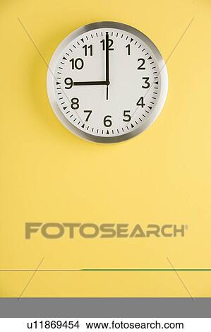 Office Clock Displaying 9 O'clock View Large Photo Image Picture - Office Clock Displaying 9 O'clock. Fotosearch